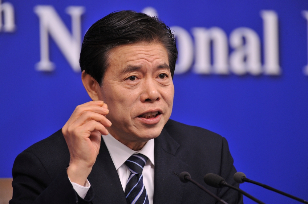 Chinese Commerce Minister Zhong Shan attends a news conference on the sidelines of the National People's Congress (NPC) in Beijing, China March 11, 2018. REUTERS/Stringer 