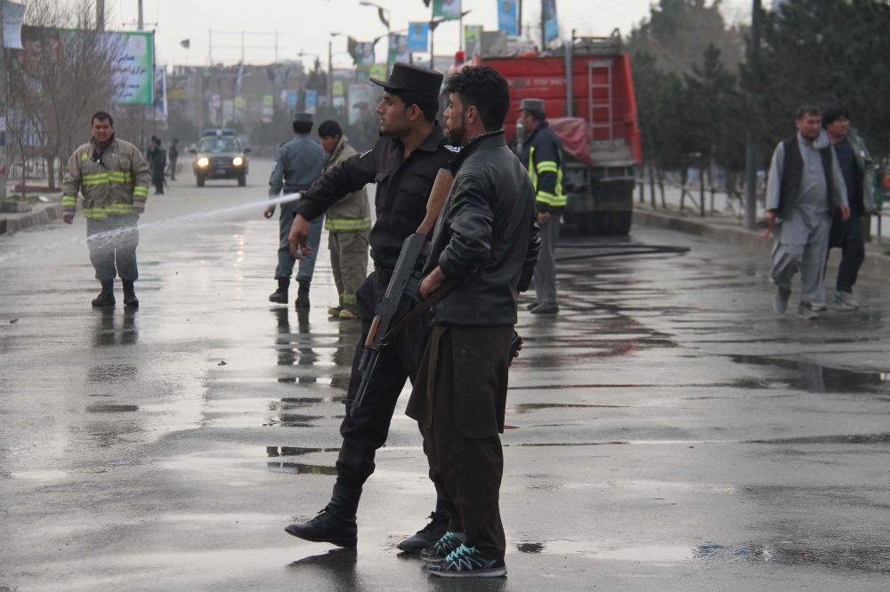 File photo of Afghan security officials standing guard at the explosion site in Kabul, Afghanistan on March 9, 2018. (Haroon Sabawoon - Anadolu Agency)
