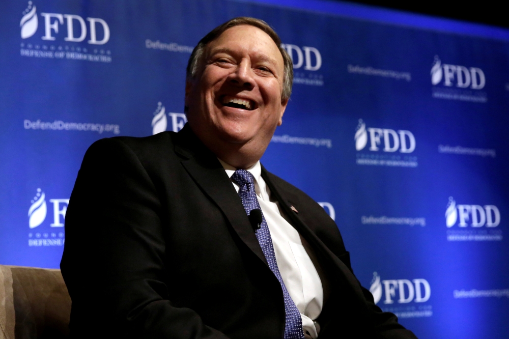 FILE PHOTO: CIA Director Mike Pompeo laughs during the FDD National Security Summit in Washington, DC, U.S., October 19, 2017. REUTERS/Yuri Gripas/File Photo
