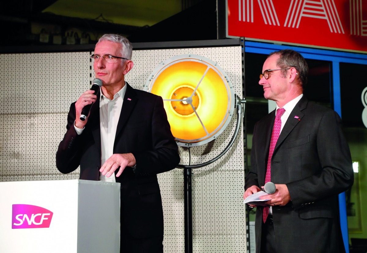 Head of the French national state-owned railway company SNCF Guillaume Pepy (L) flanked by director of SNCF Reseau Patrick Jeantet speaks at the Ground Control venue near the Gare de Lyon in Paris on March 12, 2018, during the celebrations of French rail 