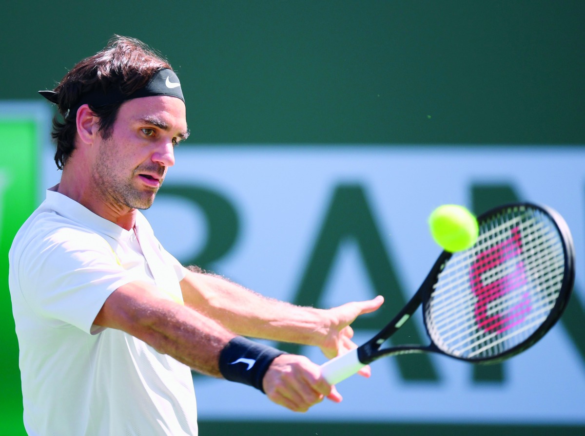 Roger Federer of Switzerland hits a backhand in his match against Filip Krajinovic of Serbia during the BNP Paribas Open at the Indian Wells Tennis Garden on March 12, 2018 in Indian Wells, California. Harry How/Getty Images/AFP