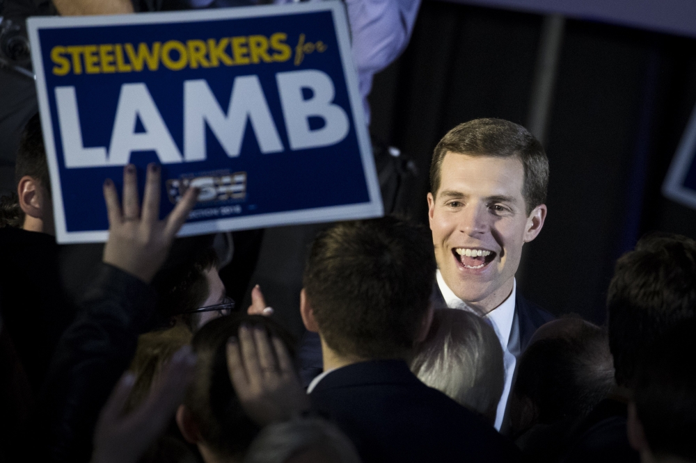 Conor Lamb, Democratic congressional candidate for Pennsylvania's 18th district, greets supporters at an election night rally March 14, 2018 in Canonsburg, Pennsylvania. Drew Angerer/Getty Images/AFP
