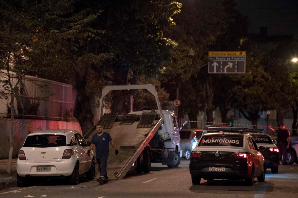 Rio's Civil Police officers transport Brazilian politician Marielle Franco's car, where she was found shot dead in Rio de Janeiro, Brazil on March 15, 2018. AFP / Mauro Pimentel

