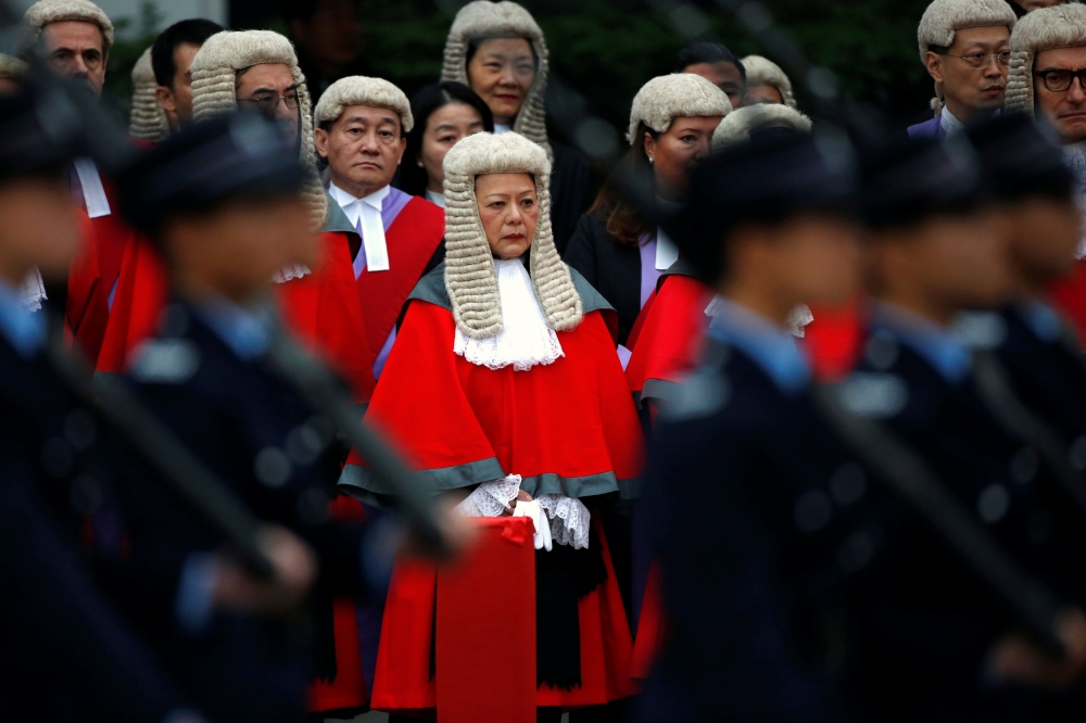 Police march past judges during a ceremony to mark the beginning of the legal year in Hong Kong, China January 8, 2018. Reuters/Bobby Yip