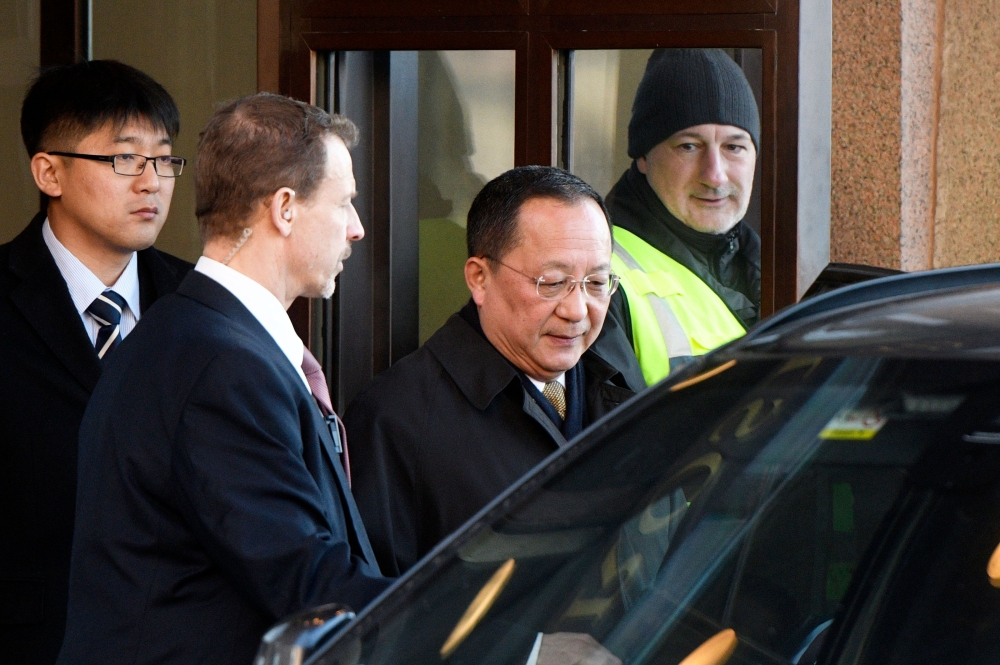 North Korean Foreign Minister Ri Yong Ho (C) leaves the Swedish goverment building Rosenbad in central Stockholm on March 16, 2018. AFP / TT News Agency / Vilhelm Stokstad 