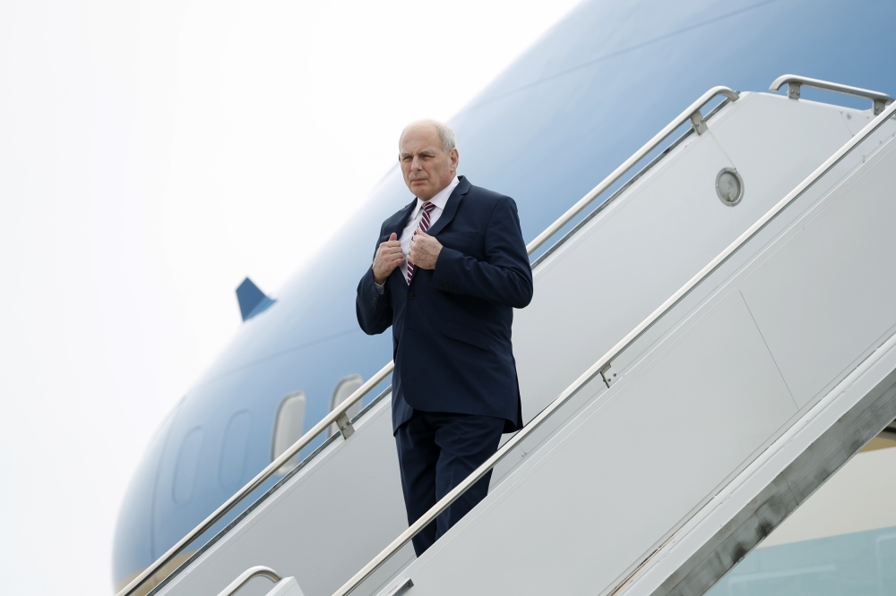 White House Chief of Staff John Kelly descends the stairs of Air Force One after arriving with U.S. President Donald Trump at Marine Corps Air Station Miramar in San Diego, California. U.S., March 13, 2018. Reuters/Kevin Lamarque