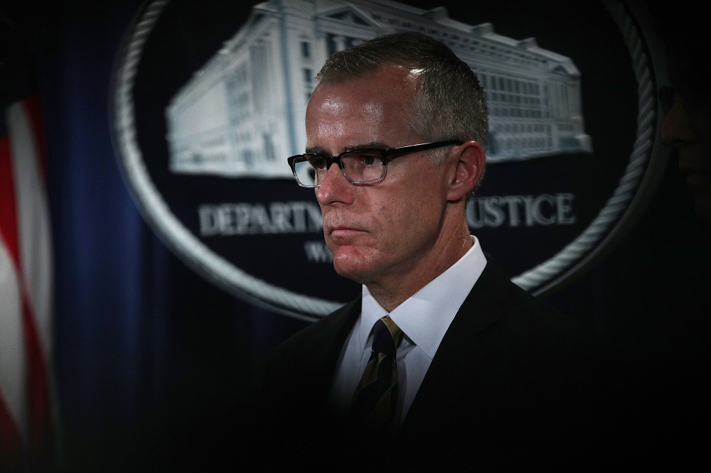 (FILES) In this file photo taken on July 12, 2017, acting FBI Director Andrew McCabe listens during a news conference to announce significant law enforcement actions at the Justice Department in Washington, DC. AFP / ALEX WONG