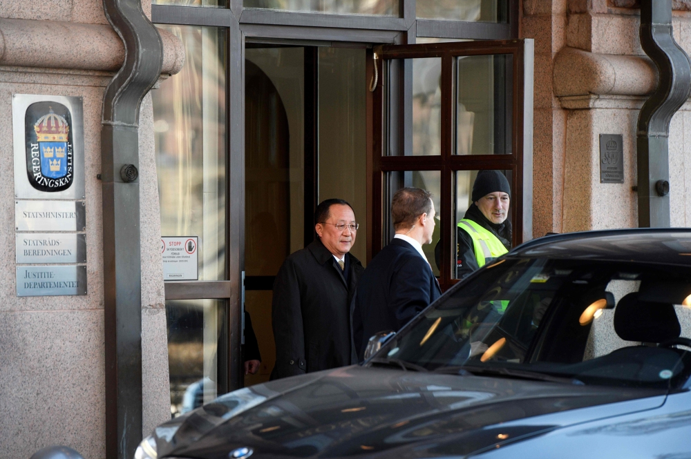 North Korean Foreign Minister Ri Yong Ho (L) leaves the Swedish goverment building Rosenbad in central Stockholm on March 16, 2018. Sweden OUT / AFP / TT News Agency / Vilhelm STOKSTAD 
