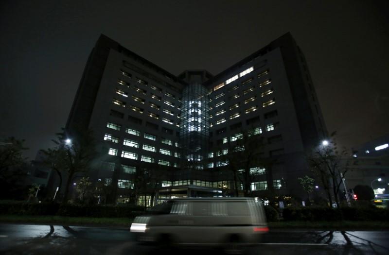 FILE PHOTO: A van is seen on a road in front of Tokyo Regional Immigration Bureau which includes the Tokyo detention center in Tokyo, Japan. REUTERS
