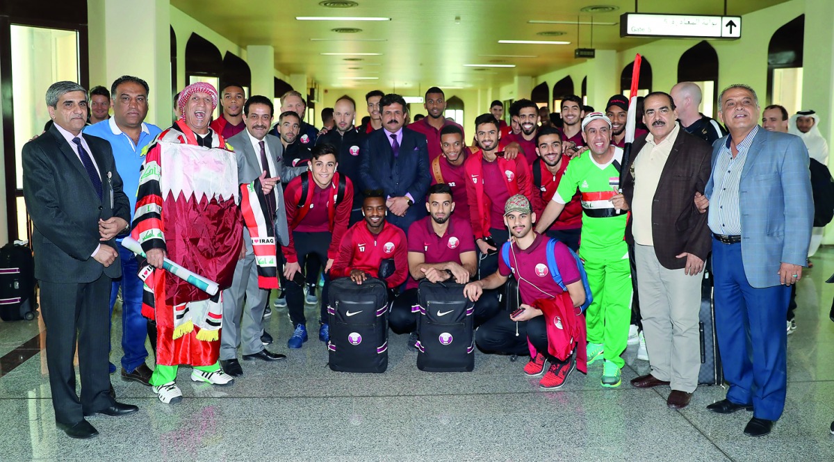 Qatar football players and officials pose for a photograph with Iraq Football Association (IFA) officials and fans upon arrival in Basra yesterday ahead of their matches against Iraq and Syria yesterday. 