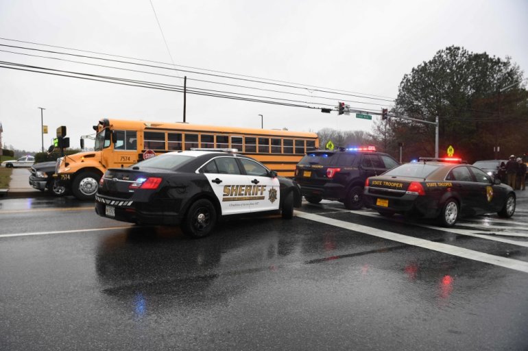 Sheriffs and Maryland State Troopers gather on March 20, 2018 at Great Mills High School in Great Mills, Maryland after a shooting at the school. AFP / JIM WATSON
