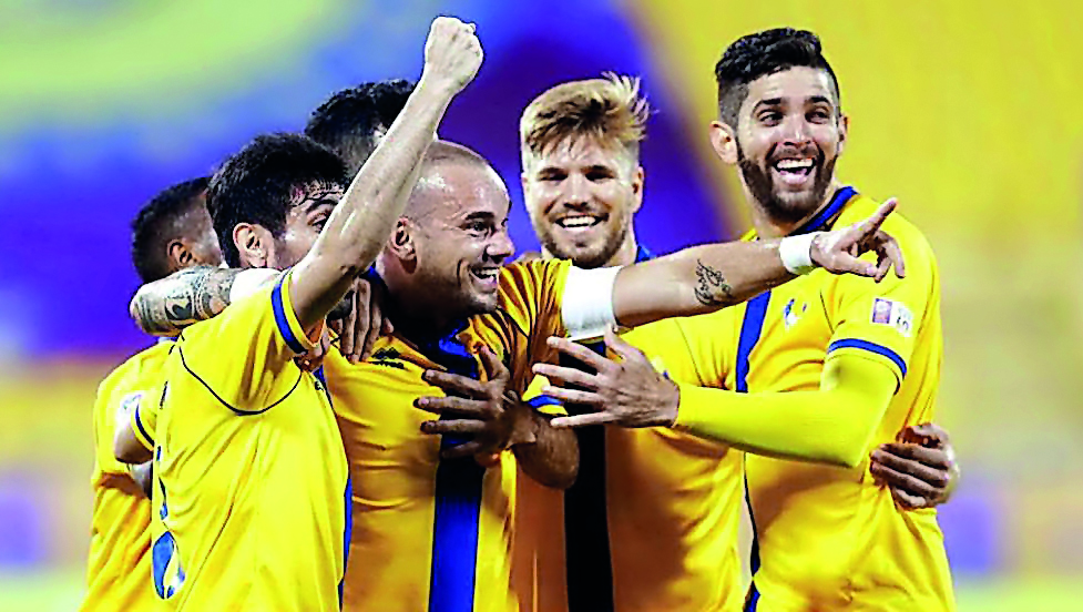 Al Gharafa players celebrate with Dutch star Wesley Sneijder (centre) after the latter scored during a QNB Stars League match in this file photo.  