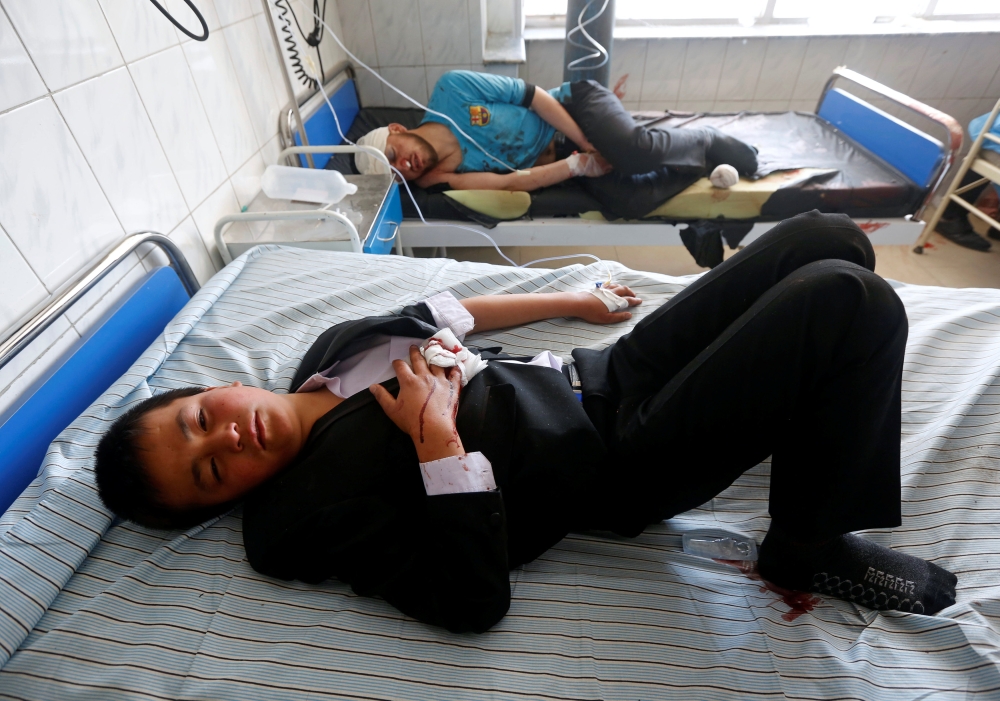 An Afghan child receives treatment at a hospital after a suicide attack in Kabul, Afghanistan March 21, 2018. Reuters/Omar Sobhani