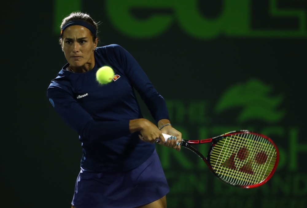 Monica Puig of Puerto Rico plays a shot against Caroline Wozniaki of Denmark during Day 5 of the Miami Open at the Crandon Park Tennis Center on March 23, 2018 in Key Biscayne, Florida. Al Bello/Getty Images/AFP 