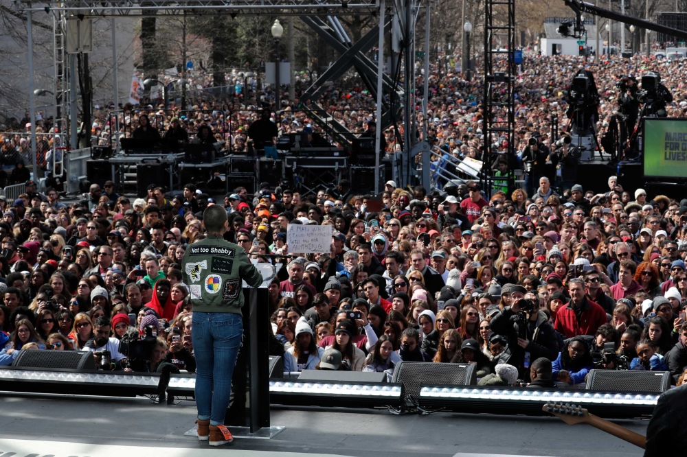 Emma Gonzalez, a student and shooting survivor from the Marjory Stoneman Douglas High School in Parkland, Florida, addresses the conclusion of the 