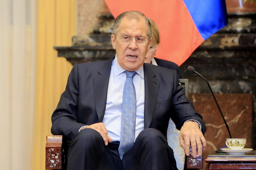 Russian Foreign Minister Sergei Lavrov talks to Vietnamese President Tran Dai Quang (not pictured) at the Presidential Palace in Hanoi, Vietnam March 23, 2018. Minh Hoang/Pool via REUTERS