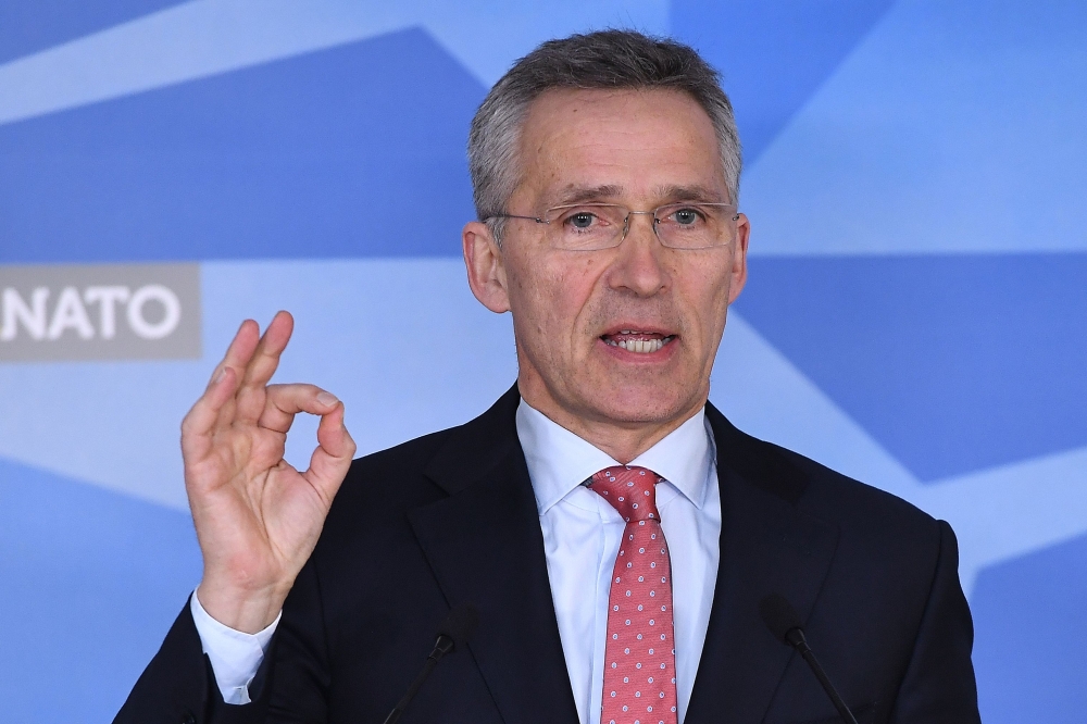 NATO Secretary General Jens Stoltenberg addresses the press at NATO headquarters in Brussels on March 27, 2018. AFP / Emmanuel Dunand