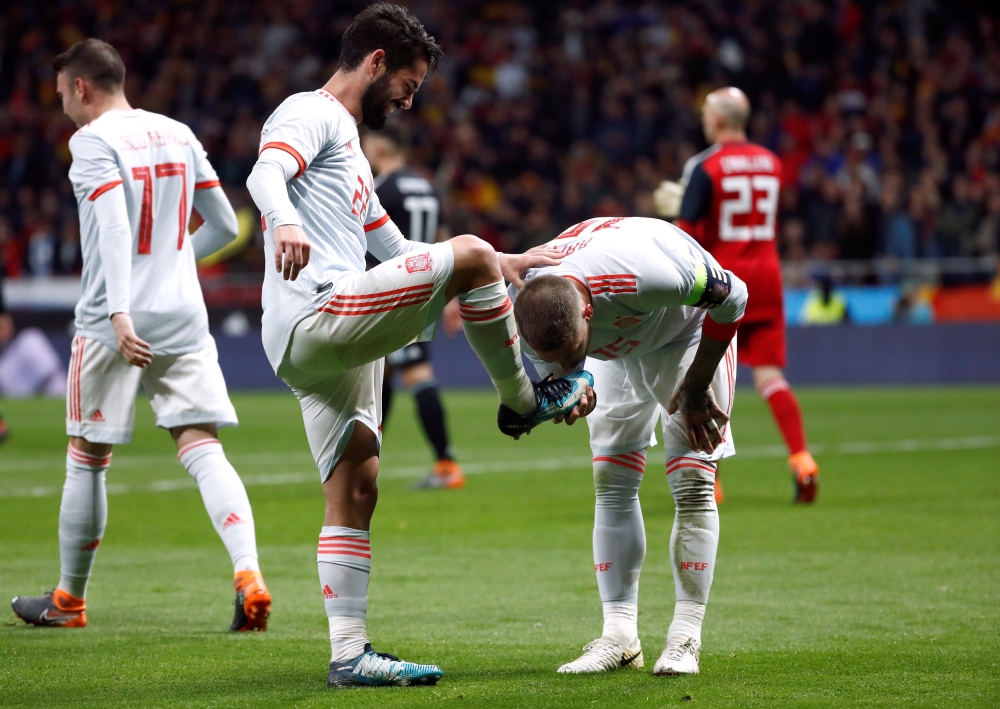 Spain's Isco celebrates scoring their third goal with Sergio Ramos REUTERS/Juan Medina
