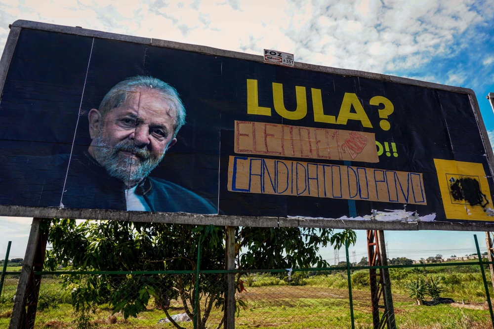 Picture of a billboard against former Brazilian President (2003-2010) Luiz Inacio Lula da Silva which was altered by his supporters in his favour, in Foz do Iguau, Parana State, Brazil, taken on March 26, 2018. AFP / Christian Rizzi