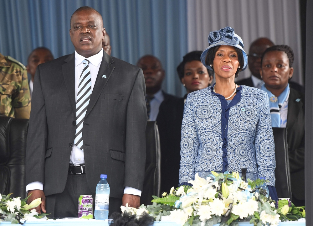 Botswana's vice-president and upcoming President Mokgweetsi Masisi (L) and his wife Neo Masisi arrive for a farawell ceremony for Botswana's President in his village Serowe on March 27, 2018, before he officially steps down on March 31 and hands power to 