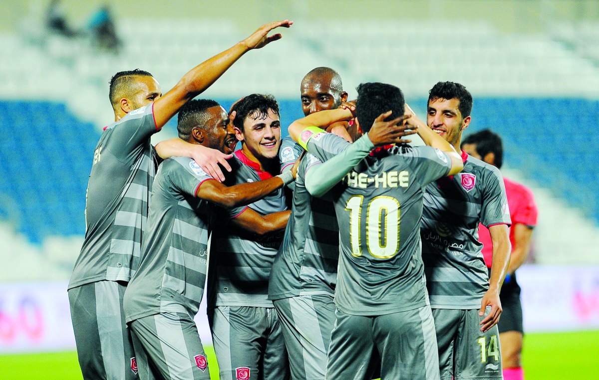Players of Al Duhail celebrate a goal against Al Kharaitiyat in their QNB Stars League match in Doha in this file photo.