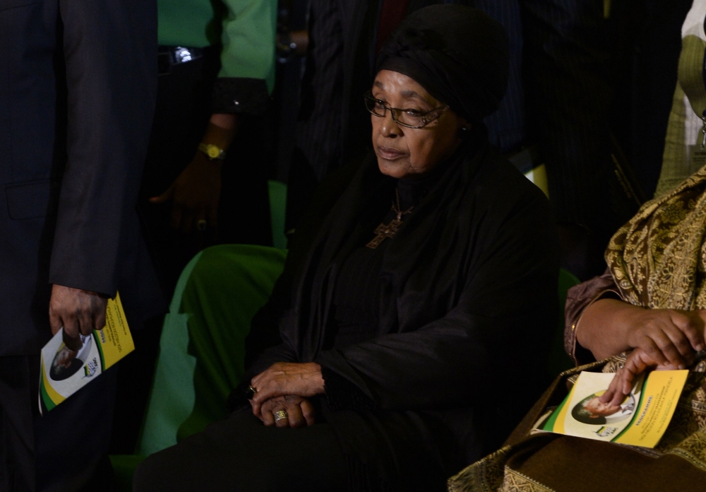 In this file photo taken on December 14, 2013 The ex-wife of Nelson Mandela, Winnie Mandela Madikizela, attends a Farewell Service for South African former president Nelson Mandela at the Waterkloof air force base in Pretoria before the departure of Mande