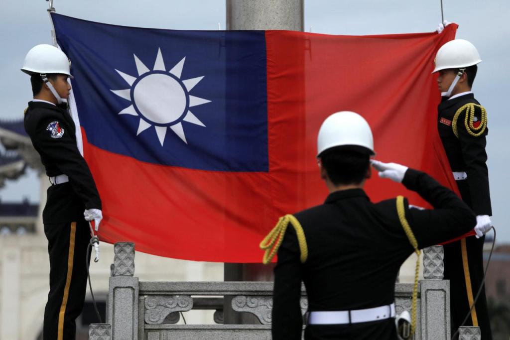 File photo of military honour guards attending a flag-raising ceremony at Chiang Kai-shek Memorial Hall, in Taipei, Taiwan March 16, 2018. REUTERS/Tyrone Siu