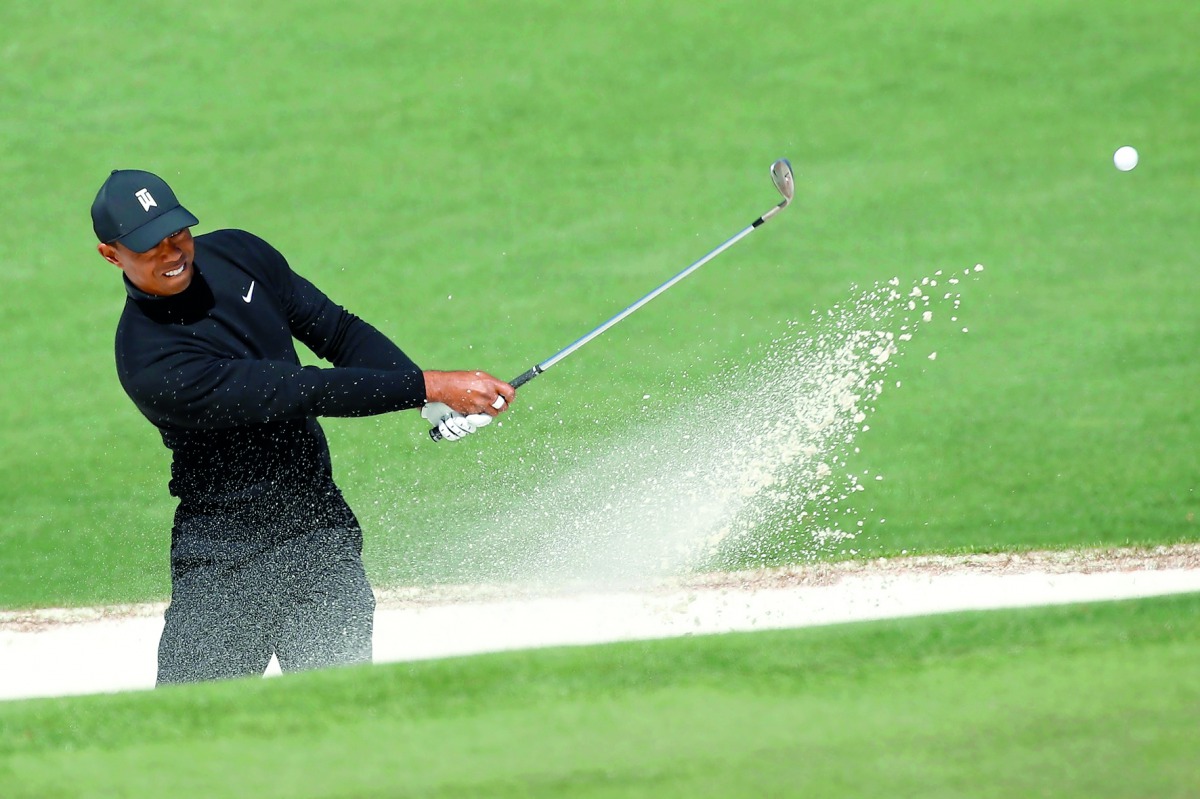 Tiger Woods of the U.S. hits from a sand trap on the second hole during first round play of the 2018 Masters golf tournament at the Augusta National Golf Club in Augusta, Georgia, April 5, 2018. Reuters/Mike Segar