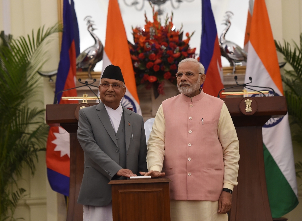 Indian Prime Minister Narendra Modi (R) and Prime Minister of Nepal K.P. Sharma Oli look on during the inauguration of India-Nepal petroleum products pipeline and the Integrated Check Post (ICP), at Hyderabad house, in New Delhi on April 7, 2018. / AFP / 