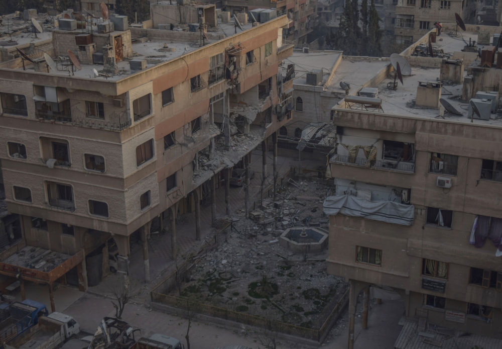 Destroyed buildings are seen after Assad Regime carried out an airstrike at Duma town of Eastern Ghouta in Damascus, Syria on April 07, 2018. Mouneb Taim - Anadolu 
