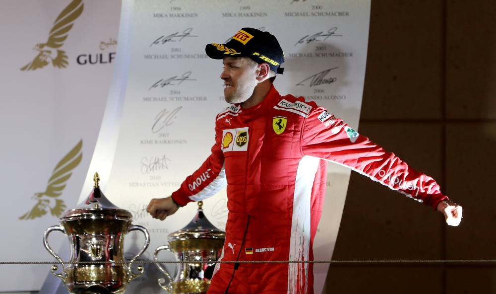 Ferrari's Sebastian Vettel celebrates with the trophy after winning the race REUTERS/Ahmed Jadallah
