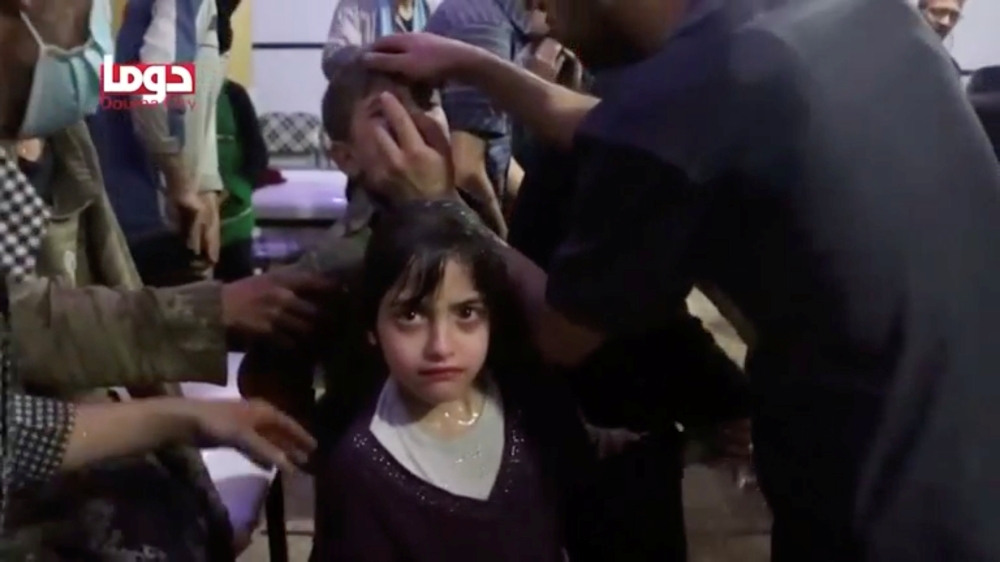 A girl looks on following alleged chemical weapons attack, in what is said to be Douma, Syria on April 8, 2018.