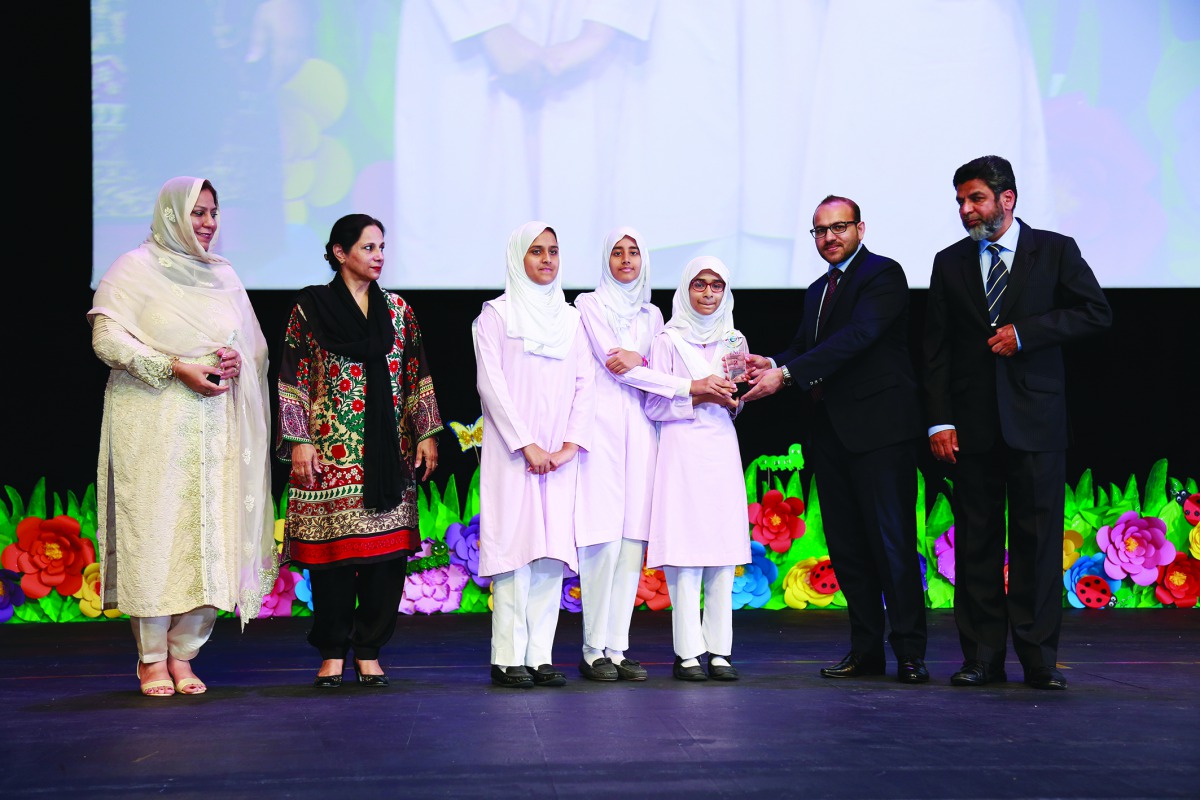 Officials distribute awards to students at the fifth TNG Youth Leadership Programme at Qatar National Convention Centre recently. 