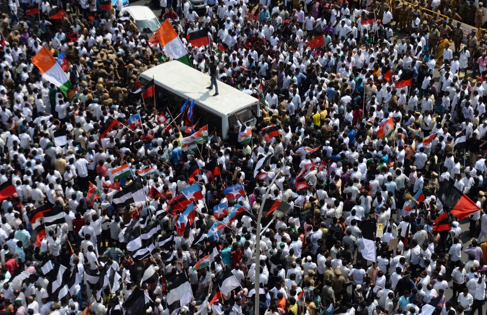 Indian members of the Darvida Munetra Kazhagam (DMK) political party and opposition groups shout slogans during a protest against the union government against the union government over a delay in the implementation of a water management board in Chennai o