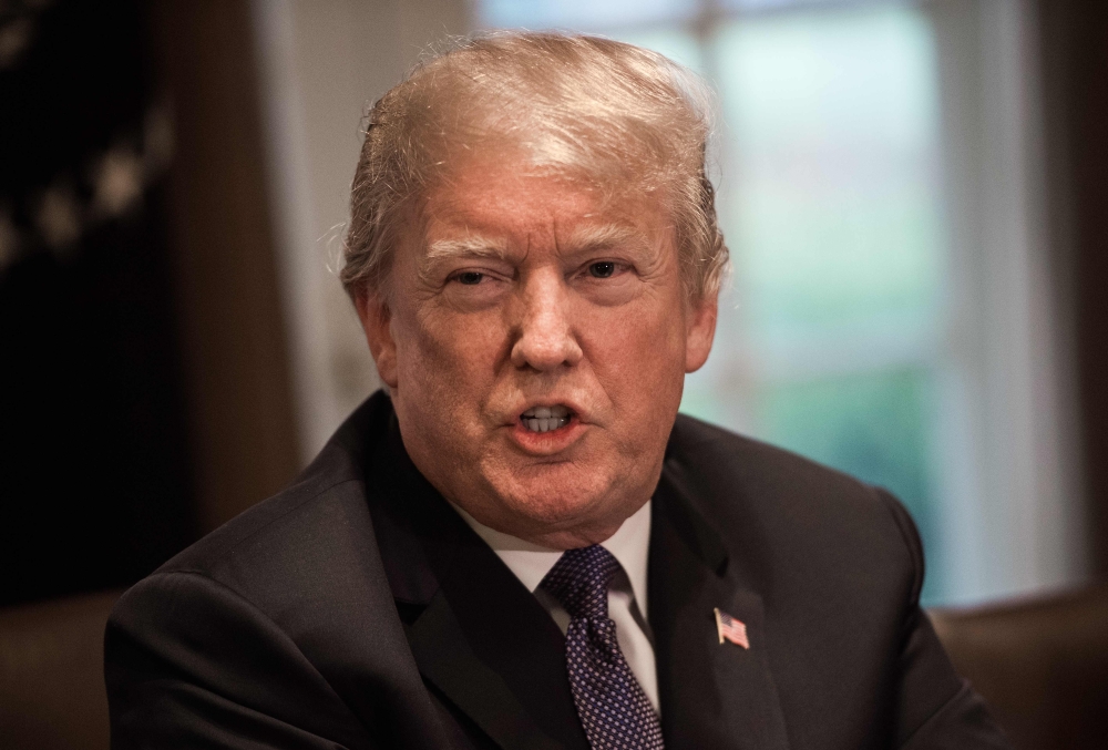 US President Donald Trump speaks during a meeting with senior military leaders at the White House in Washington, DC, on April 9, 2018.  AFP / NICHOLAS KAMM

