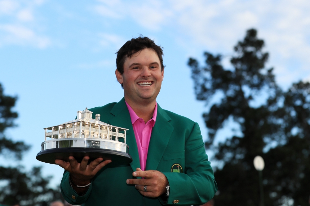 Patrick Reed of the United States celebrates with the trophy during the green jacket ceremony after winning the 2018 Masters Tournament at Augusta National Golf Club on April 8, 2018 in Augusta, Georgia. (Andrew Redington/Getty Images/AFP)