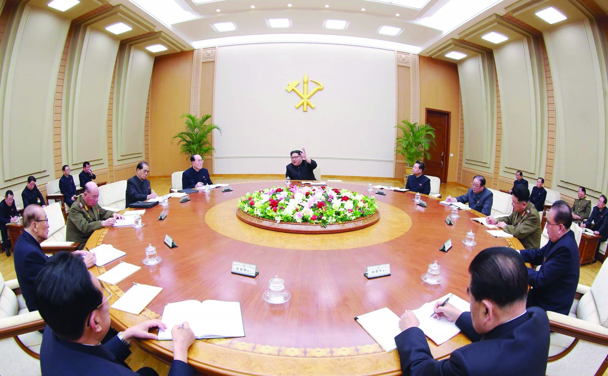 This picture taken on April 9, 2018 and released by North Korea's official Korean Central News Agency (KCNA) on April 10 shows North Korean leader Kim Jong Un (rear C) attending the Political Bureau of the Central Committee of the Workers' Party of Korea 