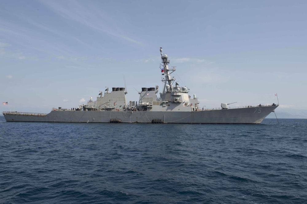 (FILES) In this file US Navy handout photo taken on March 21, 2016, USS Donald Cook (DDG 75), a guided-missile destroyer, anchoring off in Corfu, Greece, during a scheduled port visit. US NAVY