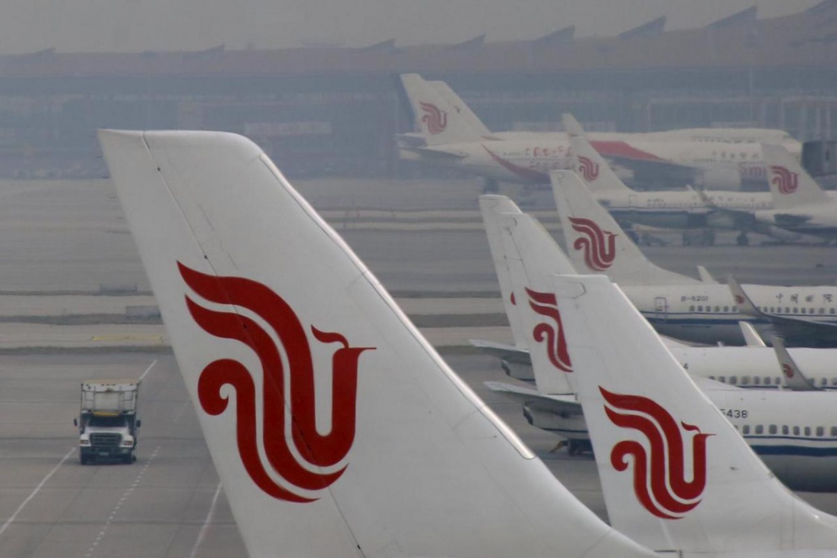 Flights of Air China are parked on the tarmac of Beijing Capital International Airport in Beijing, China, March 28, 2016. REUTERS/Kim Kyung-Hoon