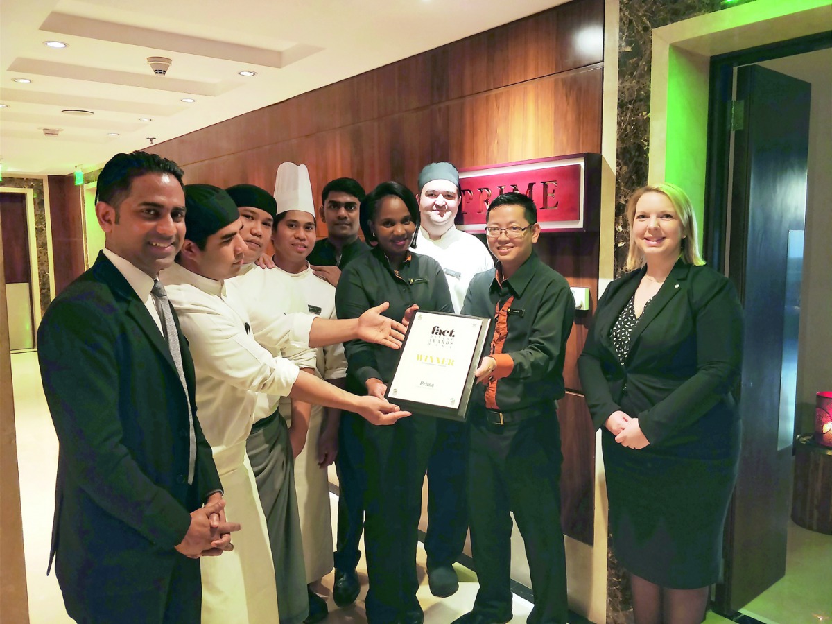 The staff and management team of the InterContinental Doha The City celebrating the success of winning two prestigious FACT Qatar Dining Awards.