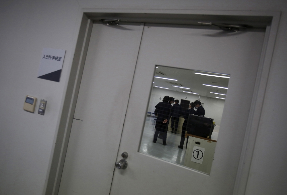 File photot of guards at the East Japan Immigration Center standing inside a processing room at the center in Ushiku, Ibaraki prefecture, Japan, March 19, 2015. REUTERS/Yuya Shino/File Photo