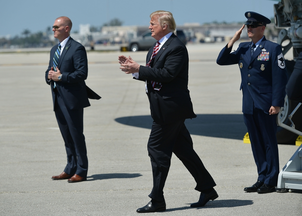 US President Donald Trump steps off Air Force One upon arrival at Palm Beach International Airport in West Palm Beach, Florida on April 16, 2018. AFP / MANDEL NGAN