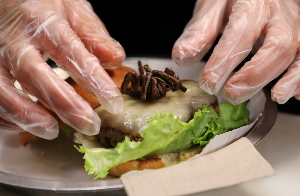 A tarantula burger is prepared at Bull City Burger and Brewery in celebration of Exotic Meat Month in Durham, North Carolina, U.S. April 16, 2018.  Reuters/Jim Urquhart