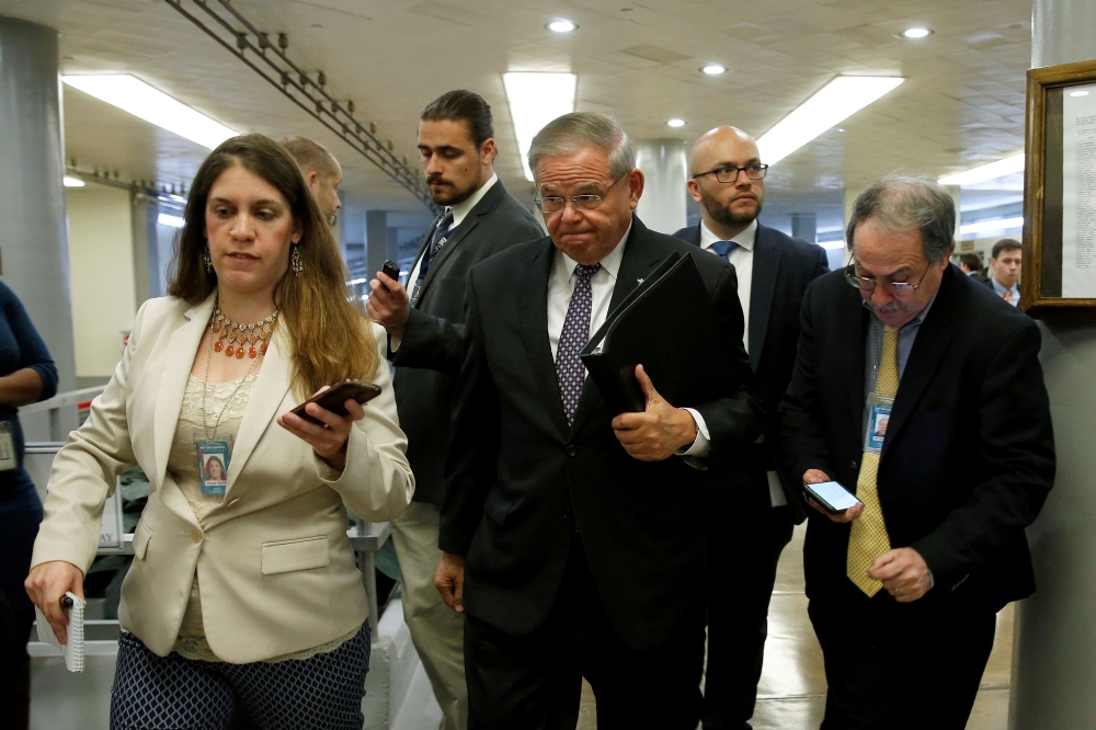 Senator Robert Menendez (D-NJ) walks to the weekly Senate Democratic policy luncheon on Capitol Hill in Washington, U.S., April 17, 2018. Reuters/Joshua Roberts