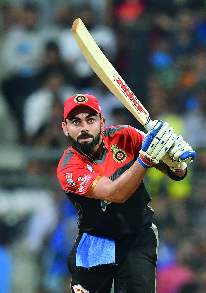 In this file photo taken on April 17, 2018, Royal Challengers Bangalore captain Virat Kohli plays a shot during the 2018 Indian Premier League (IPL) Twenty20 cricket match between Mumbai Indians and Royal Challengers Bangalore at The Wankhede Stadium in M