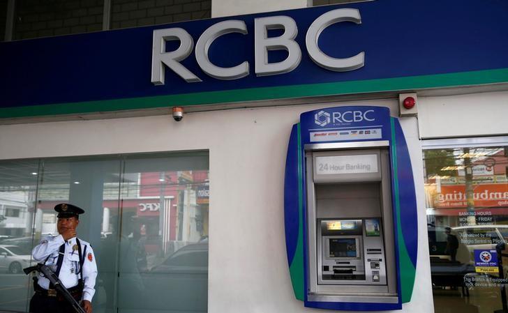 A security guard stands guard outside a branch of Rizal Commercial Banking Corporation in Paranaque city, Metro Manila, Philippines, August 2, 2016. Reuters/Erik De Castro