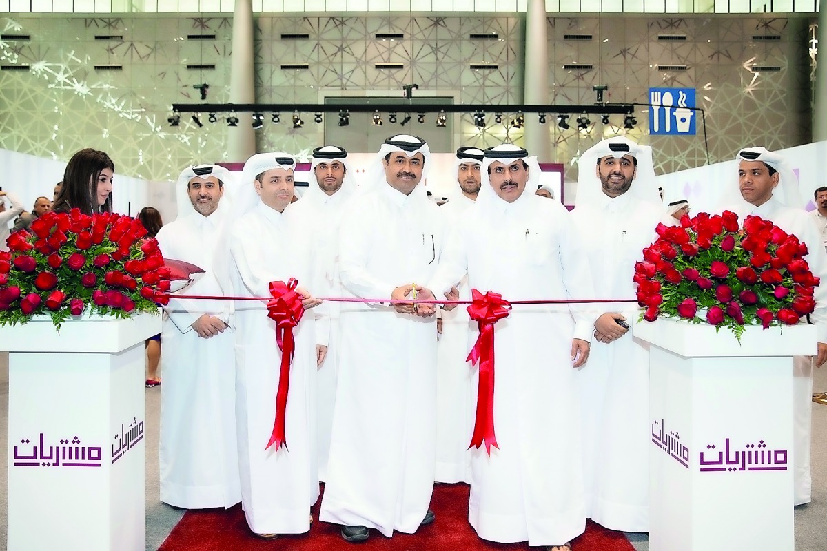 H E Dr Mohammed bin Saleh Al Sada (fourth left), Minister of Energy and Industry; H E Sheikh Abdullah bin Saud Al Thani (second right), QCB Governor;  Abdulaziz bin Nasser Al Khalifa (right), CEO of Qatar Development Bank, and other officials during the i