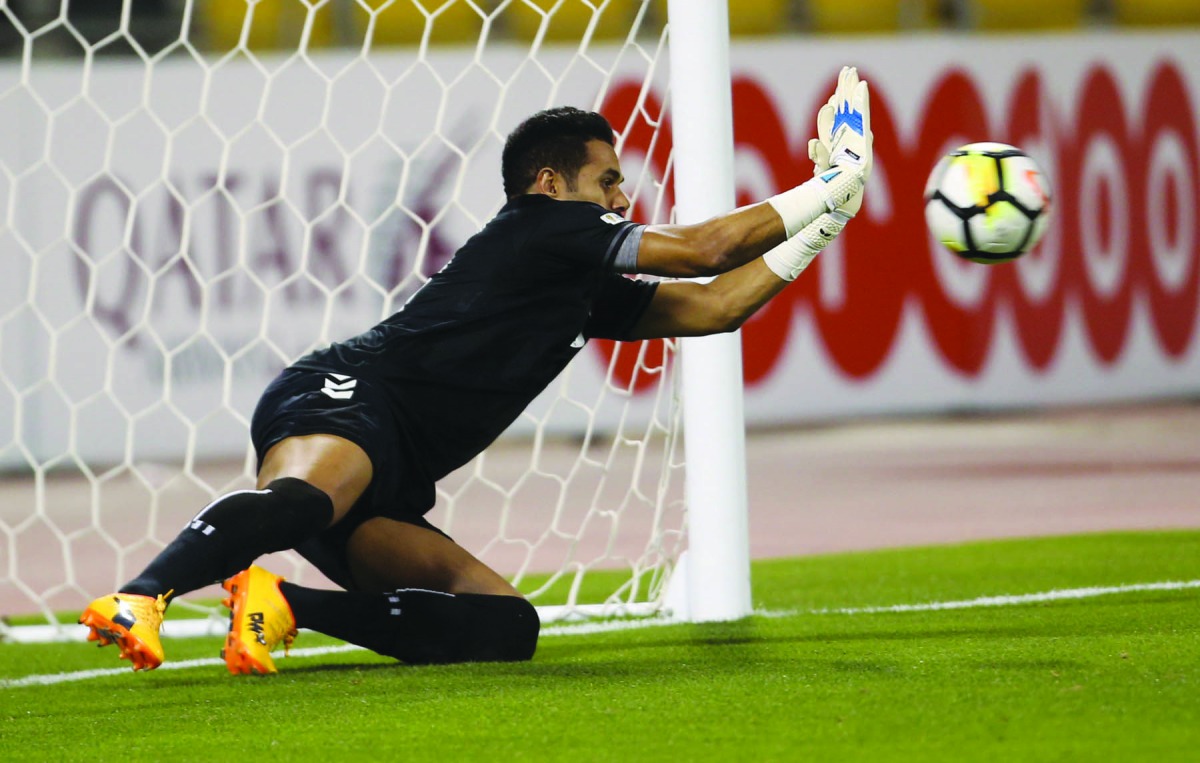 Mesaimeer goalkeeper blocks a penalty kick during their Emir Cup second round match against Al Ahli at Qatar SC Stadium yesterday. 