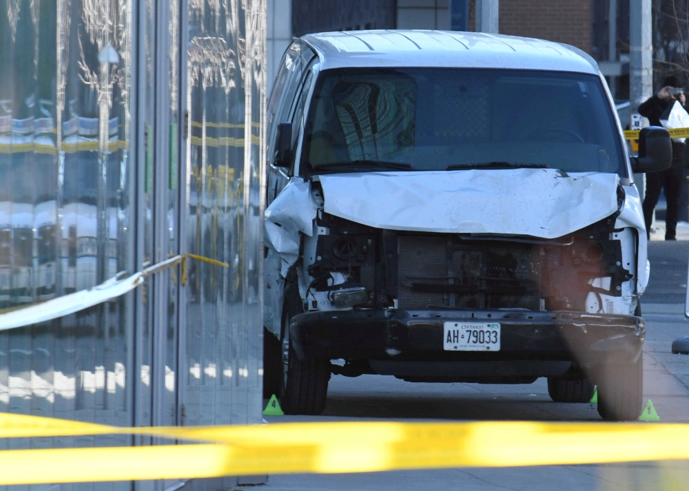A damaged van seized by police is seen after multiple people were struck at a major intersection northern Toronto, Ontario, Canada, April 23, 2018. Reuters/Saul Porto