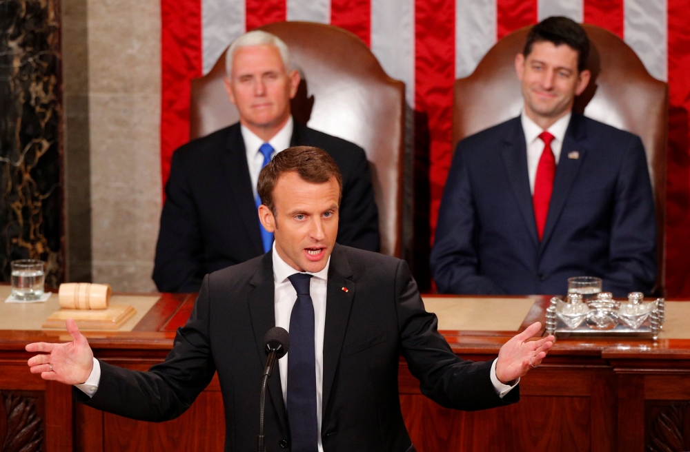 French President Emmanuel Macron gestures after addressing a joint meeting of Congress in the House chamber of the US Capitol in Washington US, April 25, 2018. Reuters/Brian Snyder